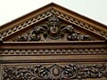 Carved pediment in music room