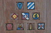 The insignias of the U.S. Divisions that fought in Alsace are emblazoned on the Sigolsheim monument: the U.S. 21st Army Corps, U.S. 12th Armored Division (bottom row, 2nd from left), the U.S. 3rd, 28th, 75th, 36th, 45th, 63rd, 103rd Infantry Divisions.