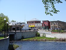 Old brick buildings and a bridge over the Kemptville Creek