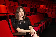 Lisa Rubin in the red theatre seats at the Segal Centre