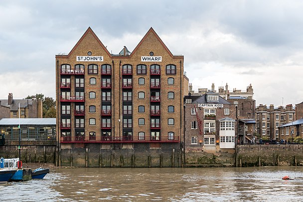 Wapping: warehouses—now flats and a pub—built on the wall