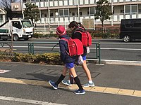 Two young girls with red randoseru, 2019.