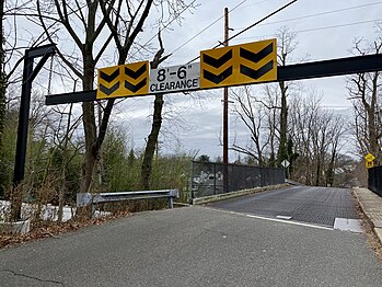 The bridge's 8-foot, 6-inch (2.6 m) height barrier on the Flower Hill end of the bridge.