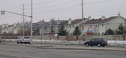 A group of homes in Barrhaven on Woodroffe Avenue, between Fallowfield Road and Earl Mulligan Drive