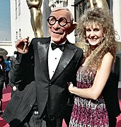 Woman carrying body puppet of George Burns at 1988 Academy Awards