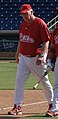 Charlie Manuel walks down the baseline with an unidentified Phillies player