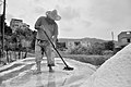 Man harvesting salt in a pond of Algeria.