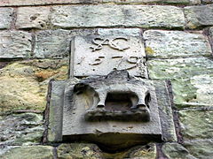 Insignia of Sir Andrew Corbet above gatehouse door