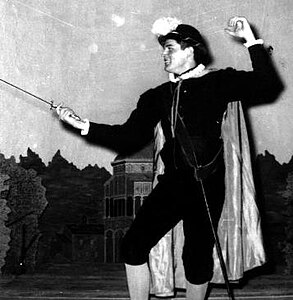 Shakespearean actor in fencing stance