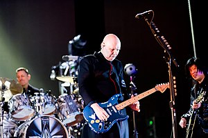 Выступление The Smashing Pumpkins в 2019 году. Слева направо: Джимми Чемберлин, Билли Корган и Джеймс Иха