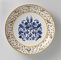 "Armorial Dish" (wapenbord) attributed to Willem Jansz. Verstraeten with arabesques on the rim reminiscent of the Urbino style tin-glazed ware, Rijksmuseum