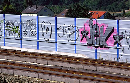 Noise abatement walls often block rail passengers' or road users' view and attract graffiti.