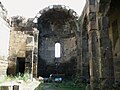 The apse at the east wall, a side chamber to the left, and to the right are the columns at the southern aisle.