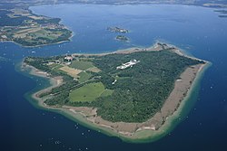 Aerial image of the Chiemsee municipality with the islands Frauenchiemsee, Krautinsel, and Herrenchiemsee (from top to bottom)