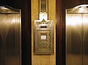 The elevator lobby of Hilton Cincinnati Netherland Plaza displays Art Deco style with original postal drop box