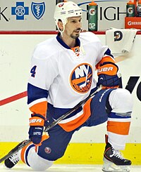 Radek Martinek stretching his legs on the ice.