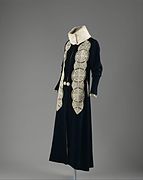 Coat in black wool with fur and leather applique (1919)