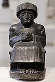 Statue of Gudea I, dedicated to the god Ningishzida; 2120 BC (the Neo-Sumerian period); height: 46 cm (20 in), width: 33 cm (10 in), depth: 22.5 cm (8.9 in); Louvre