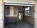 Eastbound station entrance featuring panels of public art collection "Railway Dream" bu Rachel Slick