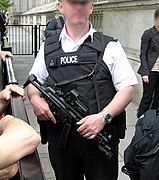 Police officer from Met police London England UK at Downing Street security holding an MP5A3