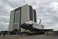 Space Shuttle Discovery rolls toward the Vehicle Assembly Building.
