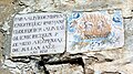 Detalle de ladrillos cerámicos en la fachada de una casa de Vallanca (Valencia), representando el Purgatorio (1831).