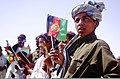 Afghan children waving national flags in Helmand Province
