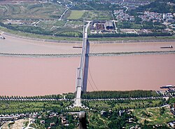 Xiling Bridge and a section of Taipingxi Town. Looking north; the Yangtze flows to the right; Sandouping in the foreground, Taipingxi in the background