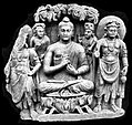 A seated Buddha triad from Sahr-i-Bahlol, similar to the Brussels Buddha, possibly dated to 132 CE.[22] Peshawar Museum.[23][24]