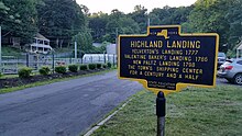 a picture of the marker with the Yelverton house behind it