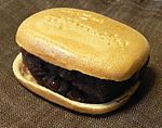 Monaka is prepared with azuki bean jam filling sandwiched between two thin crisp wafers made from mochi.