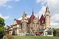 Moszna Castle with an adjoining hothouse