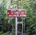 Weathered road sign naming North Fork of North Fork Breitenbush River