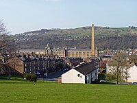 Saltaire village in the foreground with Salt's Mill in the background