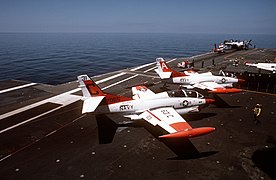 A pair of T-2s wait to be catapulted from Lexington in 1989