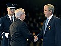 Secretary of Defense Robert M. Gates awards the medal to President George W. Bush.