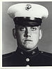 A black and white image showing the head and upper torso of Williams wearing his military dress uniform with hat.