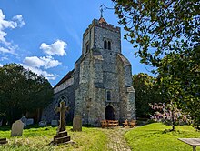 View of the tower of St. Peter's church, at Firle, East Sussex, England.