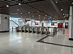 Fare gates at the concourse level of the station