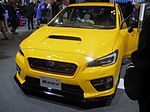Subaru S207, a high-performance variant of the Subaru WRX STI. This photo shows the front of the car, which is yellow with a small "S207" emblem on the front grille.