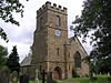 A church with a large battlemented tower