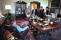 George W. Bush with his feet up on the Treaty table.