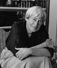 Black-and-white image of Le Guin seated facing the camera.