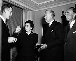 Anna M. Rosenberg being sworn in as Assistant Secretary of Defense by Felix Larkin (left), General Counsel of the Department of Defense. General George Marshall (second from right) and Robert A. Lovett (right), Deputy Secretary of Defense, witness. 15 November 1950.