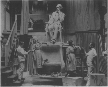Elwell, right, and a model in his studio with Dickens and Little Nell in 1890