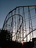 The Fujiyama roller coaster silhouetted by the setting sun