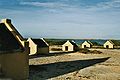 Image 5The forced African migrants brought to the Caribbean lived in inhumane conditions. Above are examples of slave huts in Dutch Bonaire. About 5 feet tall and 6 feet wide, between 2 and 3 slaves slept in these after working in nearby salt mines. (from History of the Caribbean)