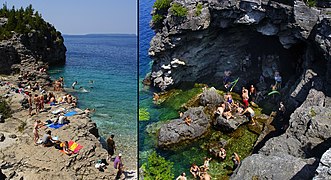 "The Grotto" and nearby rocks crowded with mid-summer vacationers
