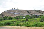 A distant view of a temple atop a hill