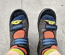 Colourful socks being worn with sandals